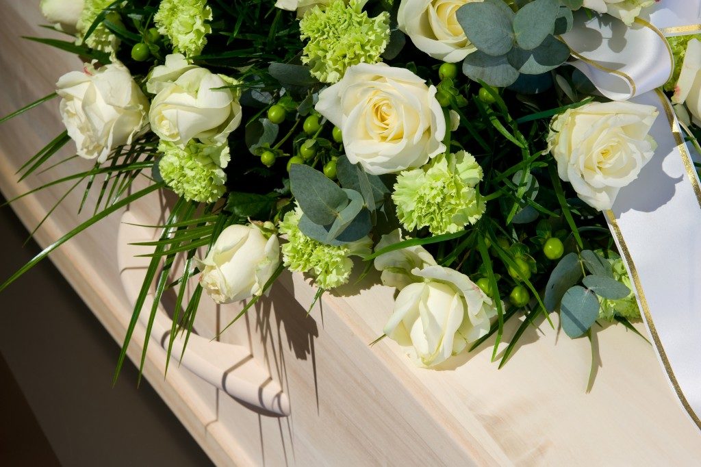 coffin with a flower arrangement