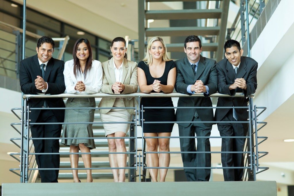 happy employees on the office staircase