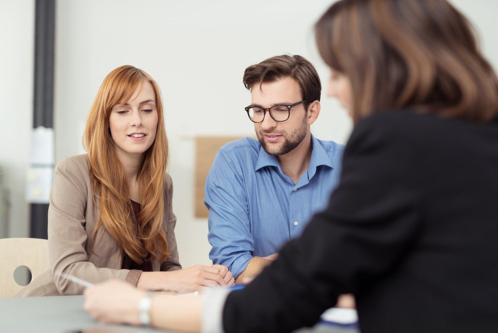 couple talking to a realtor