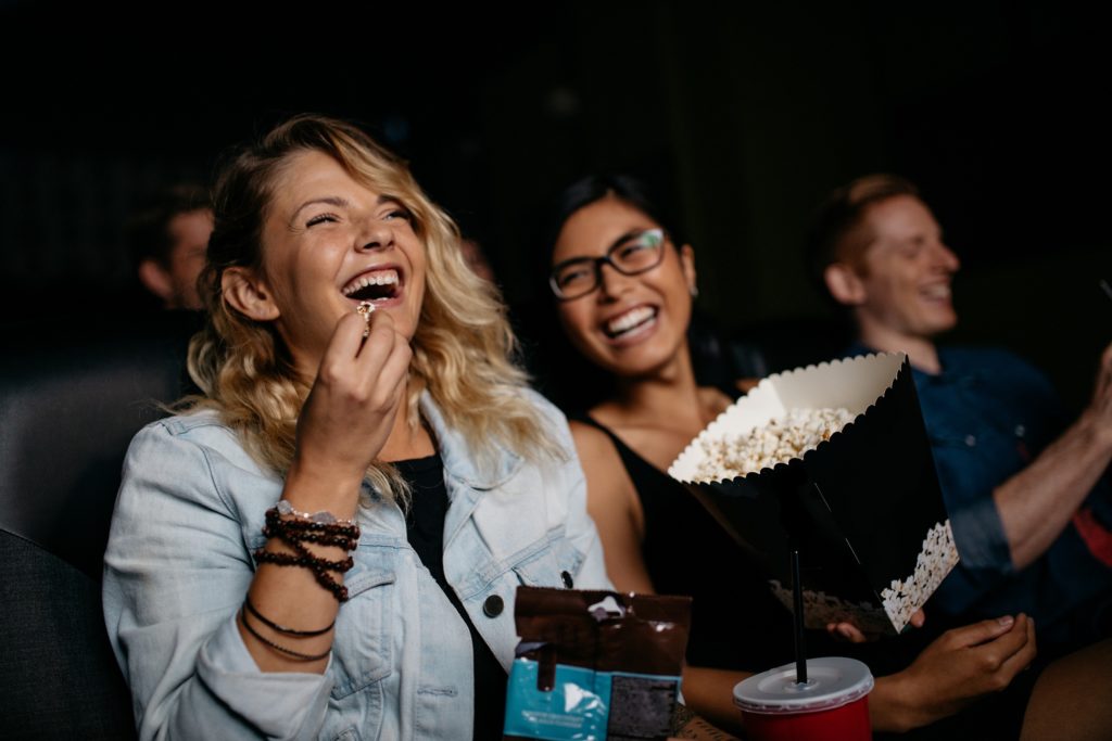 woman laughing at cinema