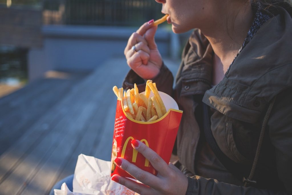 woman eating fries