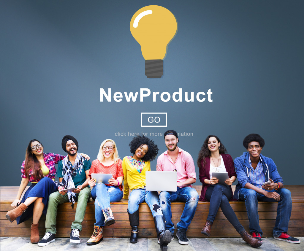 light bulb representing a new product with the concept team sitting below it